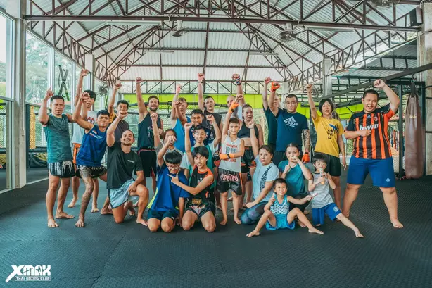 People posing learning Muay Thai